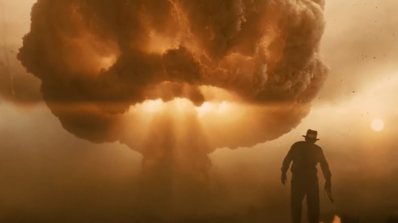 Indiana Jones looking at mushroom cloud