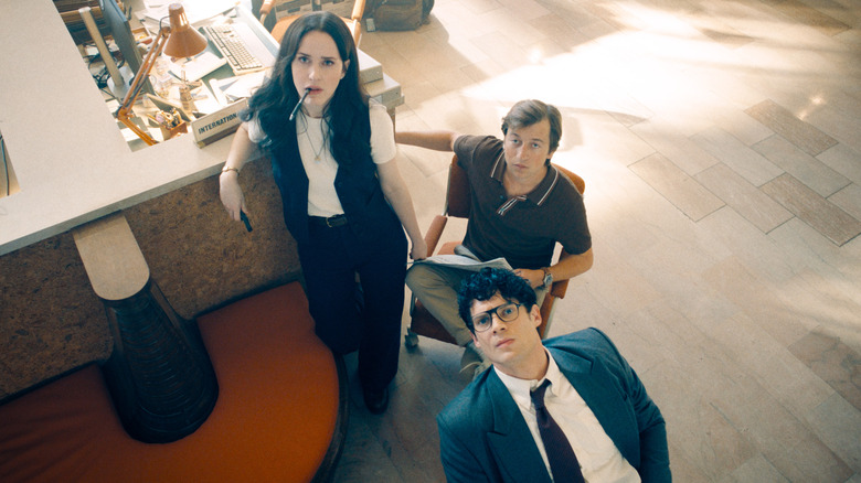 Lois, Jimmy, and Clark looking up in the newsroom in Superman (2025)