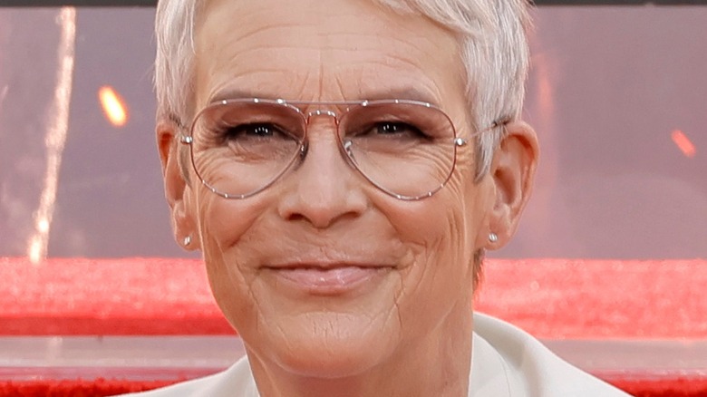 Jamie Lee Curtis in glasses smiling