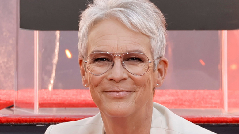 Jamie Lee Curtis in glasses smiling