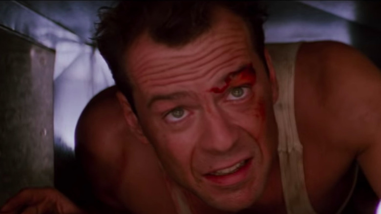 Bruce Willis as a worried John McClane in Die Hard