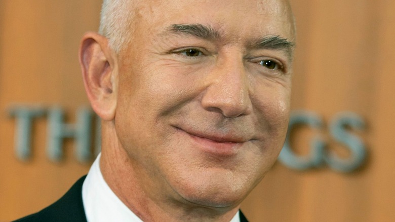 Jeff Bezos smiling for cameras