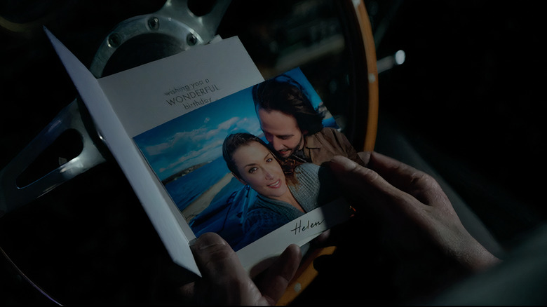 John Wick holding photo with his wife Helen Wick