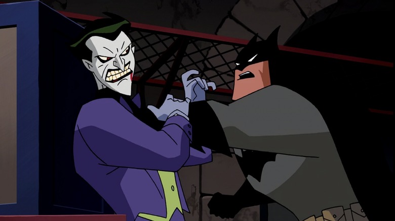 The Joker and Batman fighting