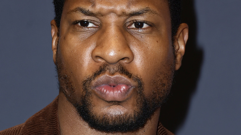 Jonathan Majors staring