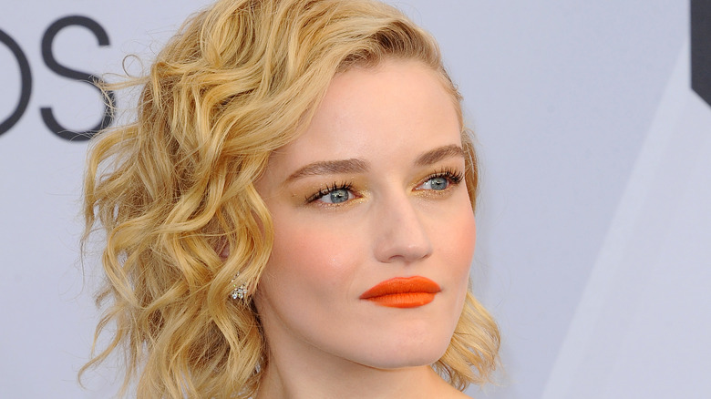 Julia Garner wearing orange lipstick