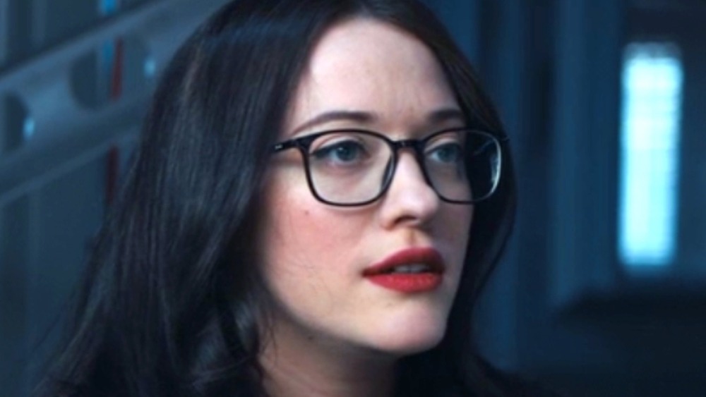 Darcy Lewis wearing glasses