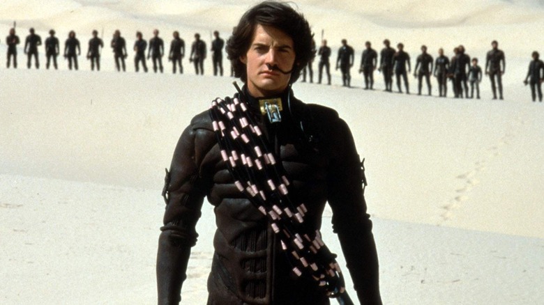 Paul standing in front of a row of men in Dune (1984)