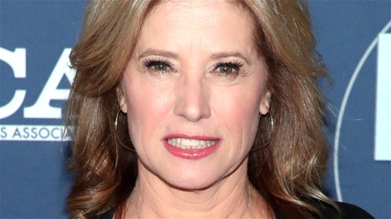 Nancy Travis smiling