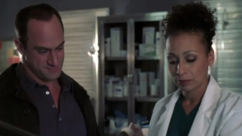 Elliot Stabler standing with Dr. Warner