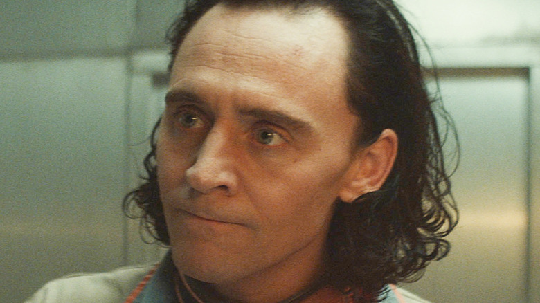 Loki with his lips pressed together