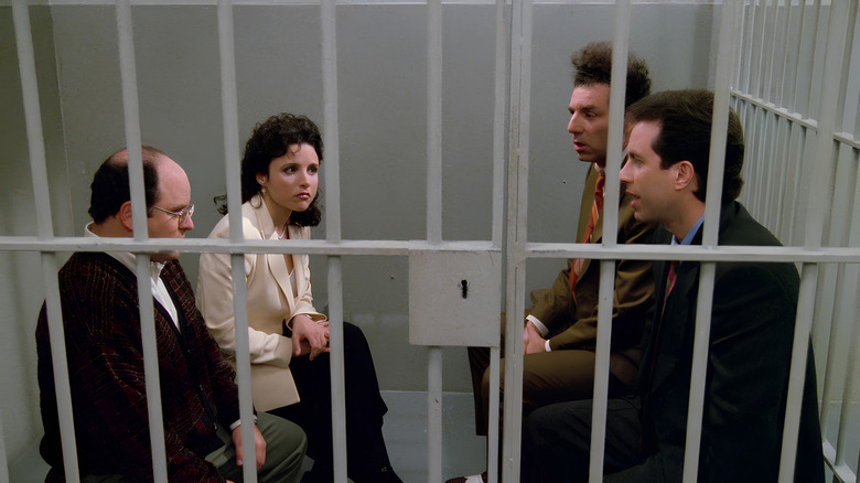 George, Elaine, Kramer, and Jerry in jail