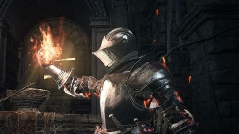 Dark Souls 3 character holding flame