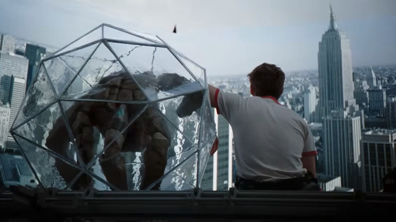 Rocky and Grace sit while looking at a picture of the New York City skyline in "Project Hail Mary" (2026)