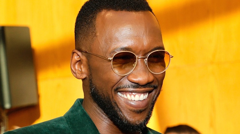 Mahershala Ali with glasses on red carpet