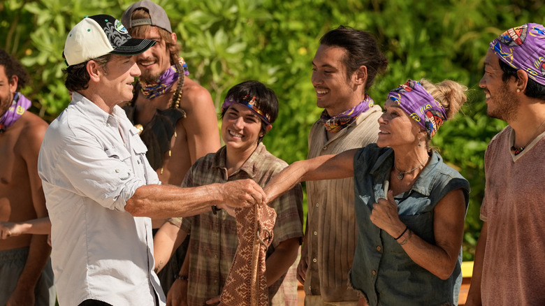 Jeff Probst giving rocks to Survivor 47 players