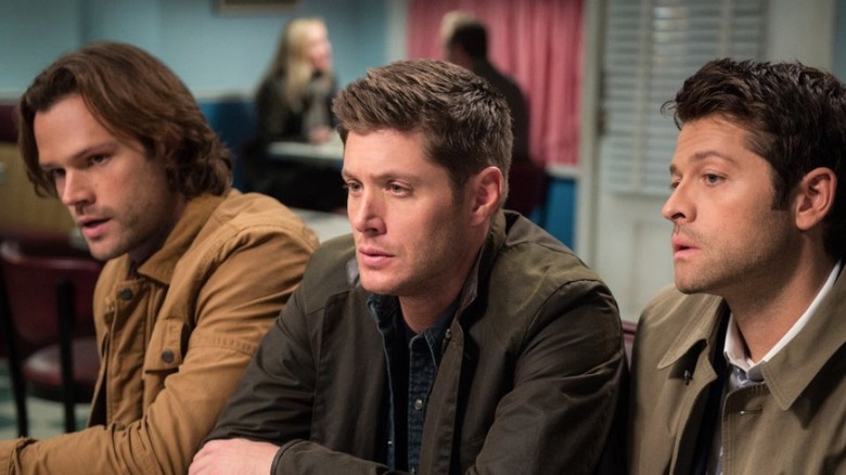 Dean, Sam, and Castiel sitting