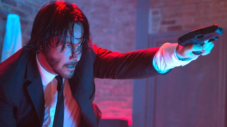 John Wick points a pistol in "John Wick: Chapter 2" (2017)