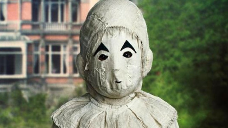 boy with white mask covering