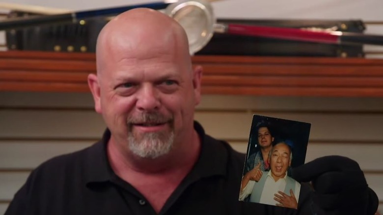 Rick Harrison holds up his photo with Pat Morita