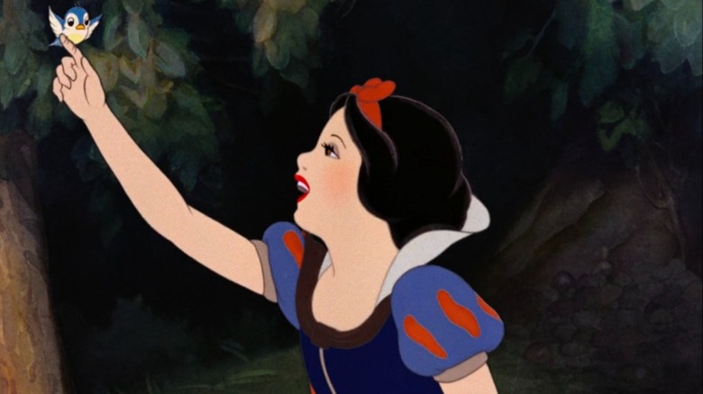 Snow White reaching for bird
