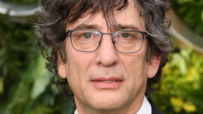 Neil Gaiman appears at a premiere event