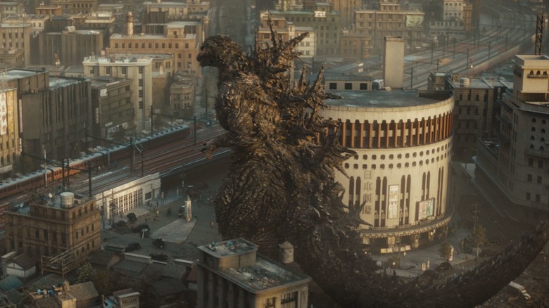 Godzilla attacking a train