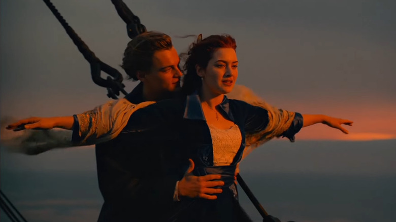 Rose spreading arms as Jack holds her