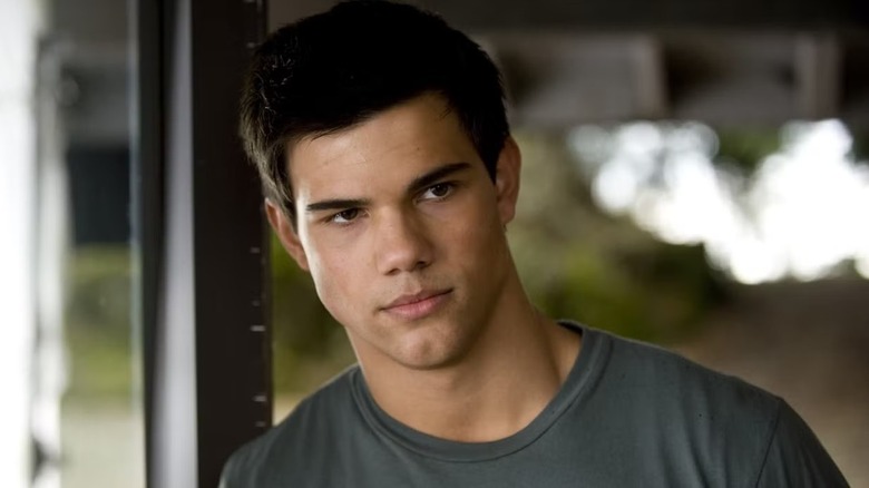 Jacob leaning against a door frame in "The Twilight Saga."