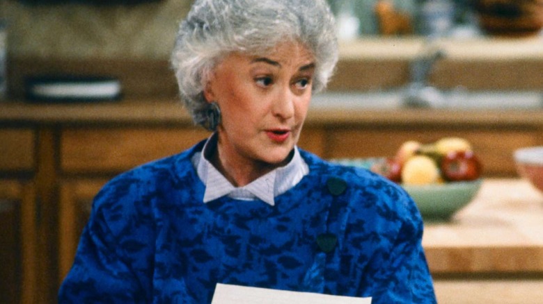 Dorothy talking sternly in a blue shirt in "The Golden Girls"
