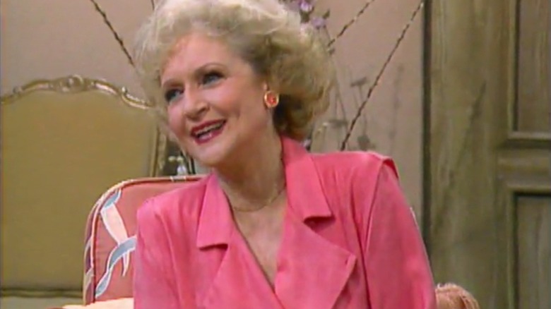 Rose smiling in a pink shirt in "The Golden Girls"