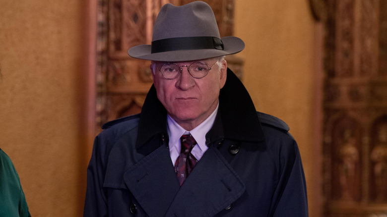 Charles-Haden Savage in trench coat and hat