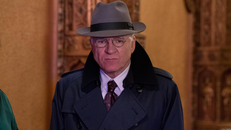 Charles-Haden Savage in trench coat and hat