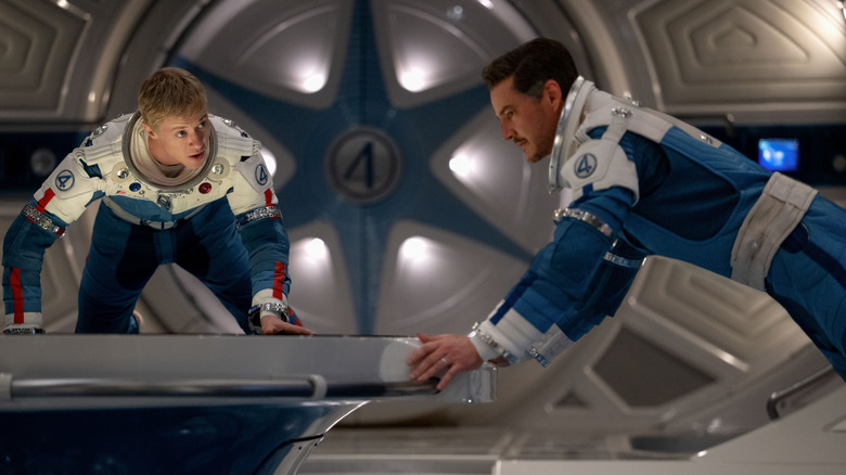 Johnny Storm and Reed Richards suspended in a spaceship in "The Fantastic Four: First Steps" (2025)