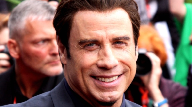 John Travolta smiles