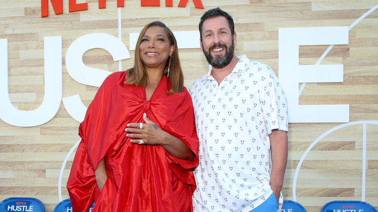 Queen Latifah and Adam Sandler posing 