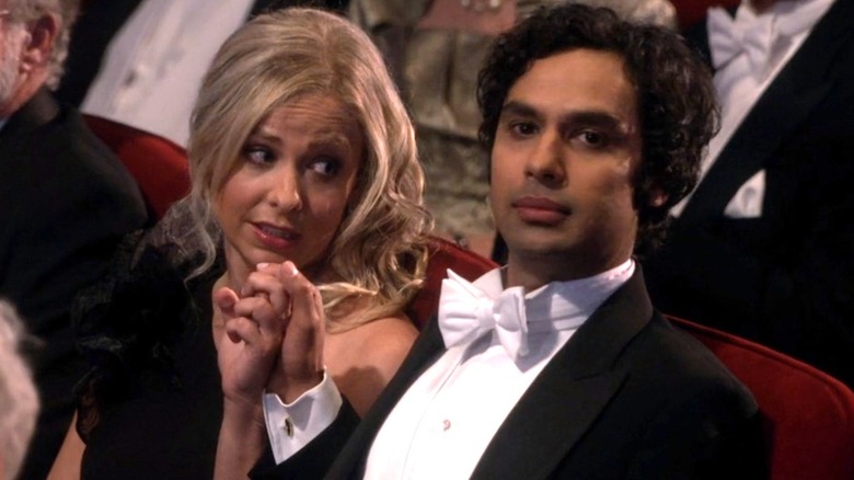 Sarah Michelle Gellar holding Raj Koothrappali's hand