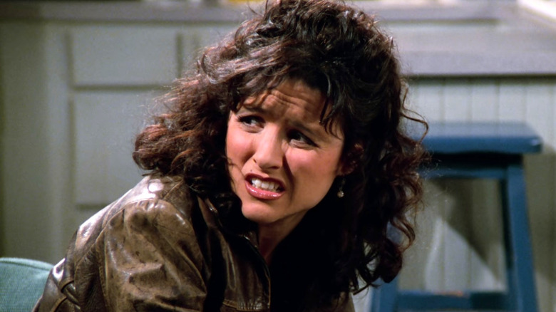 Elaine Benes looking worried to the left