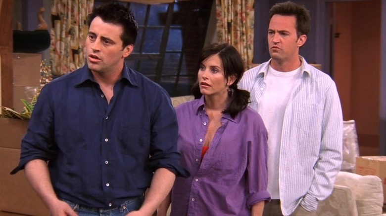 Joey Tribbiani, Monica Geller, Chandler Bing looking serious to the left