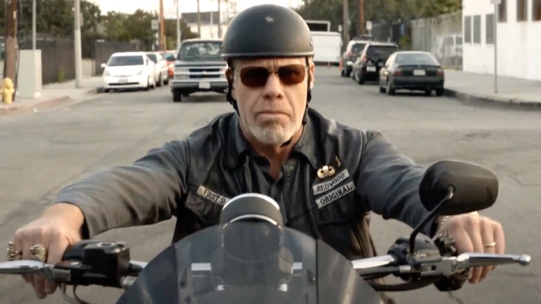 Ron Perlman riding a motorcycle