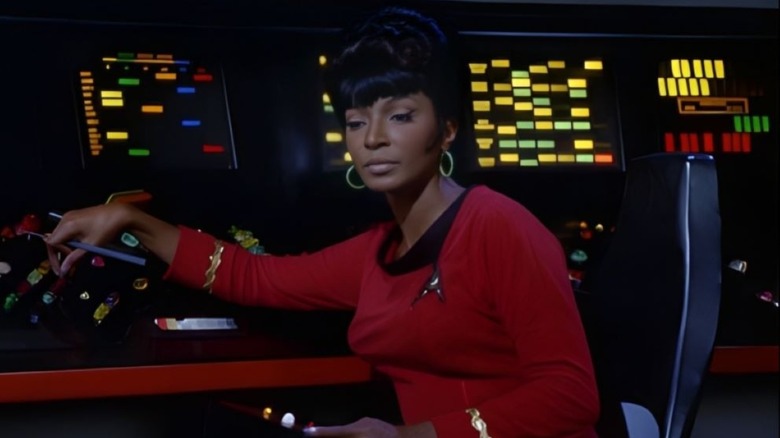 Uhura sitting at communications station