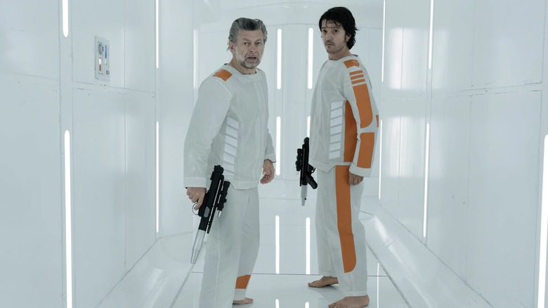 Cassian and Kino holding blasters