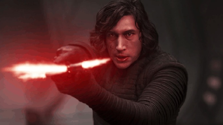Kylo Ren holding his lightsaber