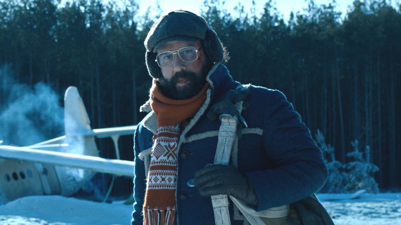 Murray standing in front of crashed plane