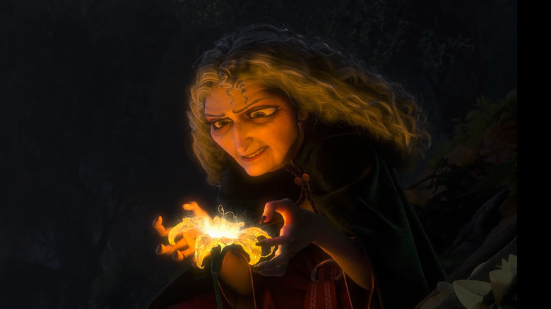 Gothel stares at glowing flower