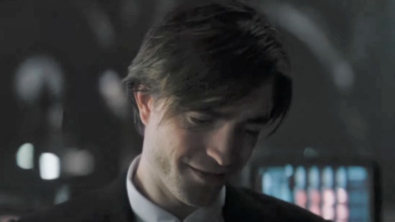 Robert Pattinson as Bruce Wayne smirking