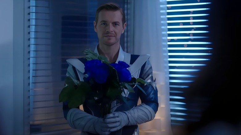 Cobalt Blue holding flowers