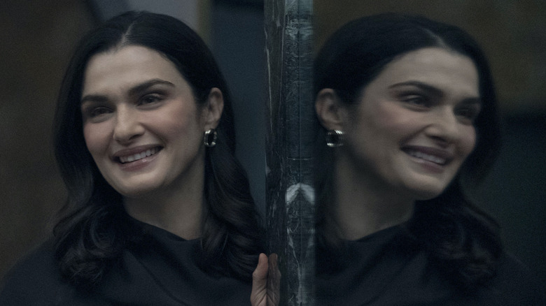 Rachel Weisz stands next to her reflection