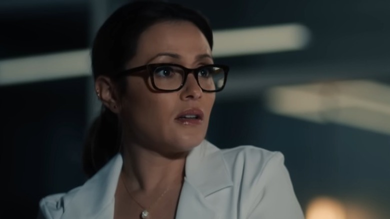 Dr. Sydney Burke looking to her side