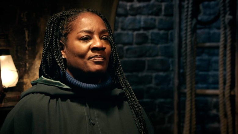 Cirie Fields in a cloak in the traitor's turret on The Traitors